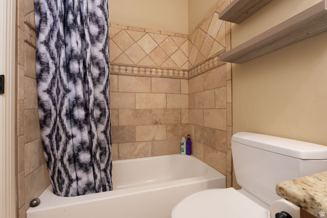 687 South 2080th Street East Springville, UT 84663 - Photo 34 of 149 Bathtub and shower surround featuring earth-toned tile with decorative border