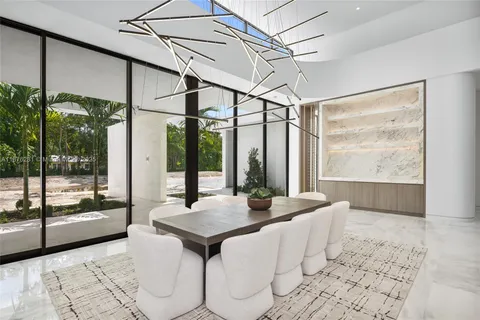 a view of a living room and a floor to ceiling window