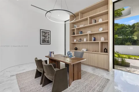 a view of a workspace with furniture