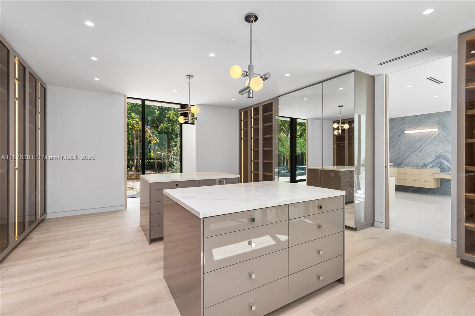 5671 Southwest 130th Avenue Southwest Ranches, FL 33330 - Photo 21 of 47 a large kitchen with kitchen island a counter space a sink appliances and cabinets