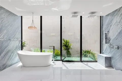 a room with a wooden floor and white walls