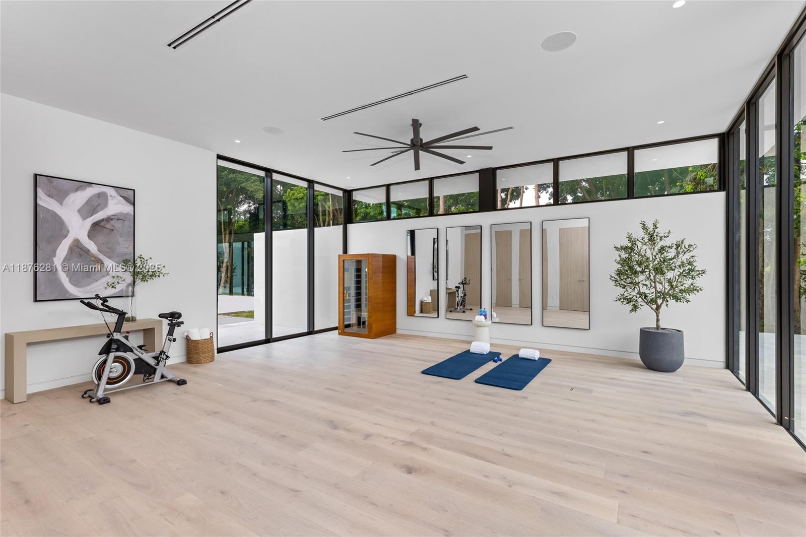5671 Southwest 130th Avenue Southwest Ranches, FL 33330 - Photo 26 of 47 a view of a room with gym equipment and windows