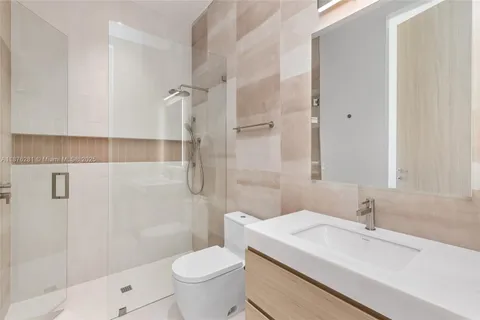 a view of room with window and wooden floor