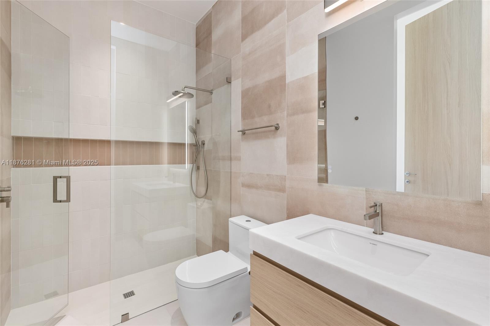 5671 Southwest 130th Avenue Southwest Ranches, FL 33330 - Photo 29 of 47 a bathroom with a sink a toilet and shower