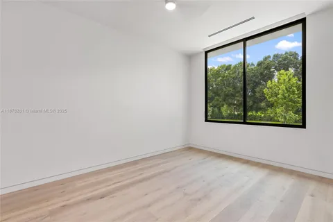 a bathroom with a toilet sink and shower