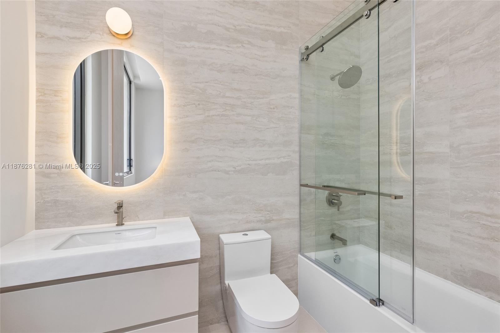 5671 Southwest 130th Avenue Southwest Ranches, FL 33330 - Photo 33 of 47 a bathroom with a toilet sink and shower