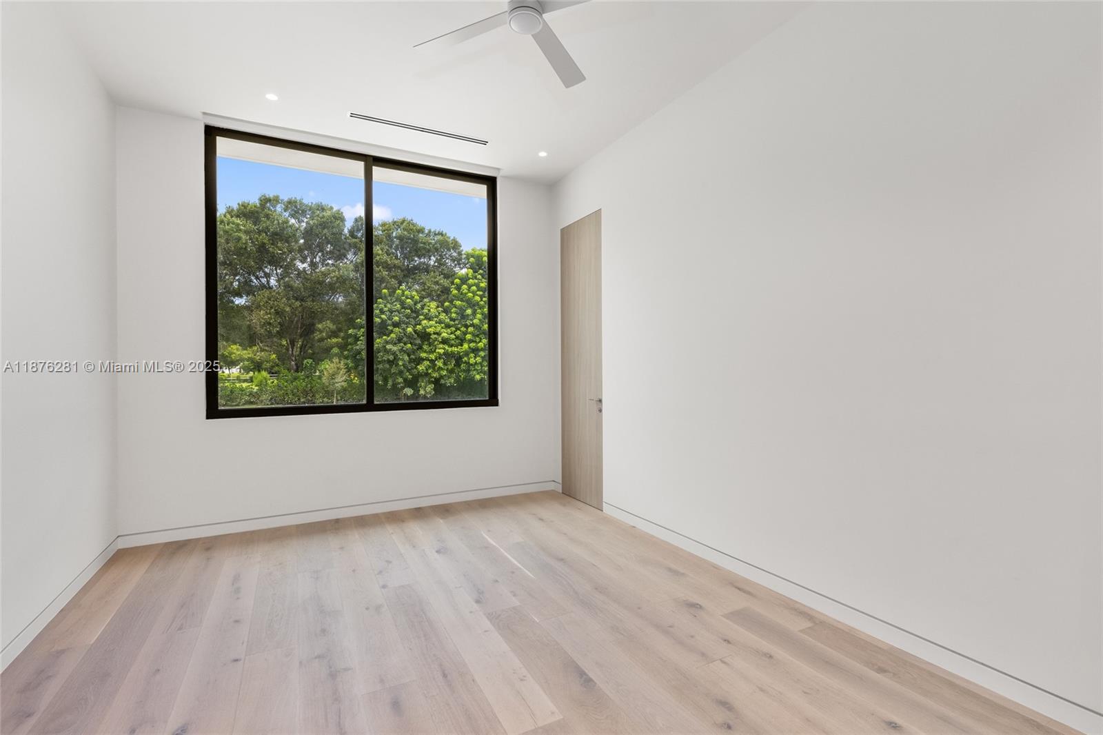 5671 Southwest 130th Avenue Southwest Ranches, FL 33330 - Photo 34 of 47 an empty room with wooden floor and windows