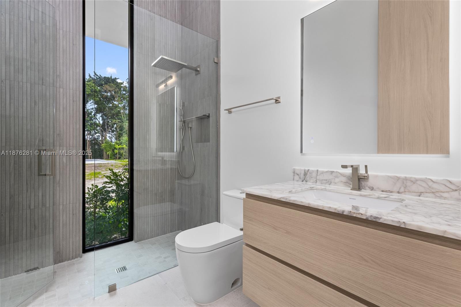 5671 Southwest 130th Avenue Southwest Ranches, FL 33330 - Photo 35 of 47 a bathroom with a granite countertop sink toilet and shower