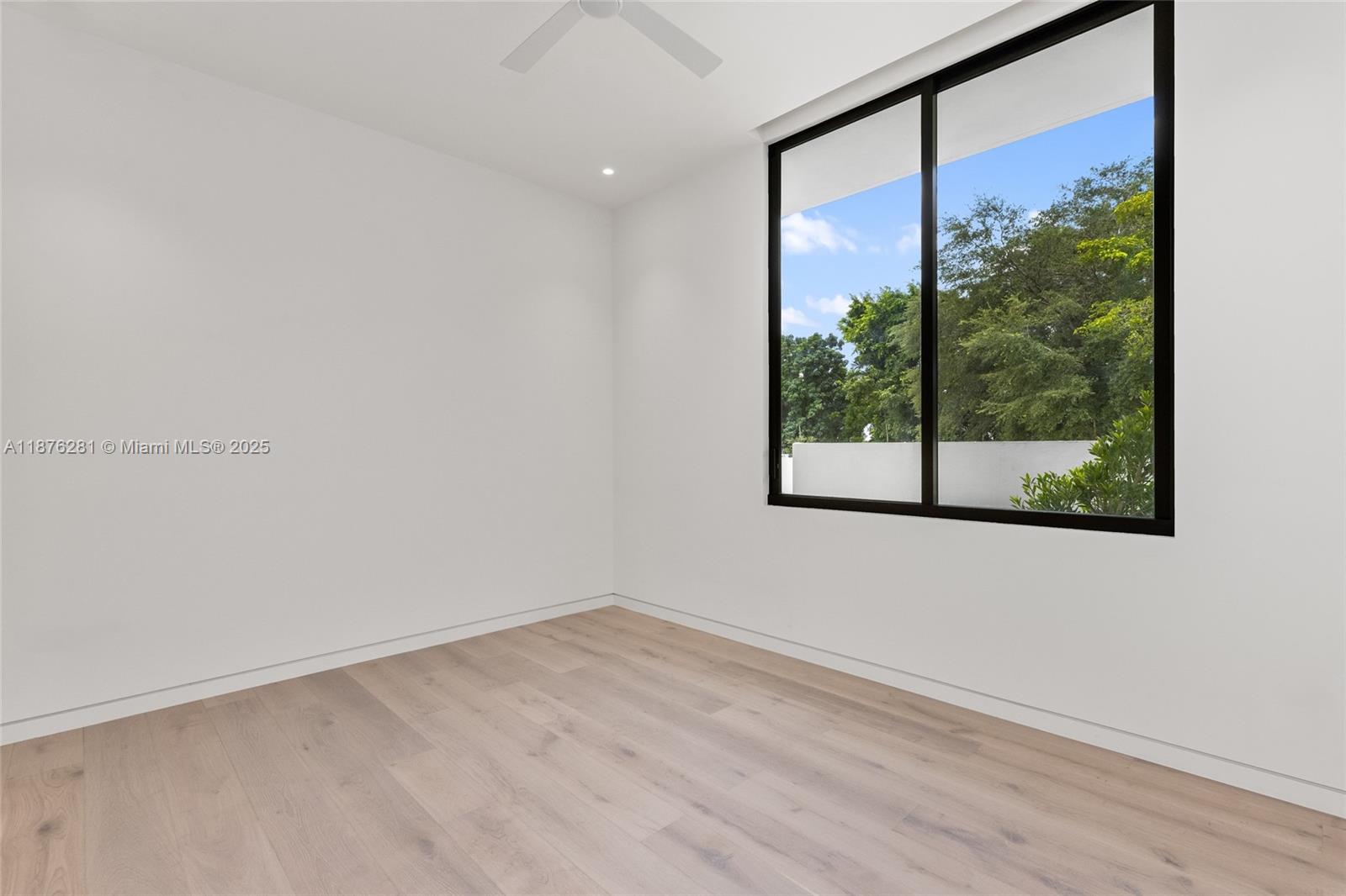 5671 Southwest 130th Avenue Southwest Ranches, FL 33330 - Photo 36 of 47 an empty room with wooden floor and windows