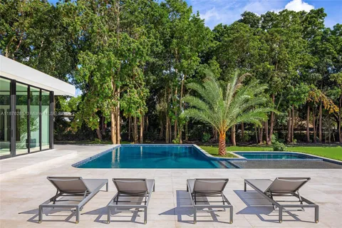 a view of swimming pool with patio