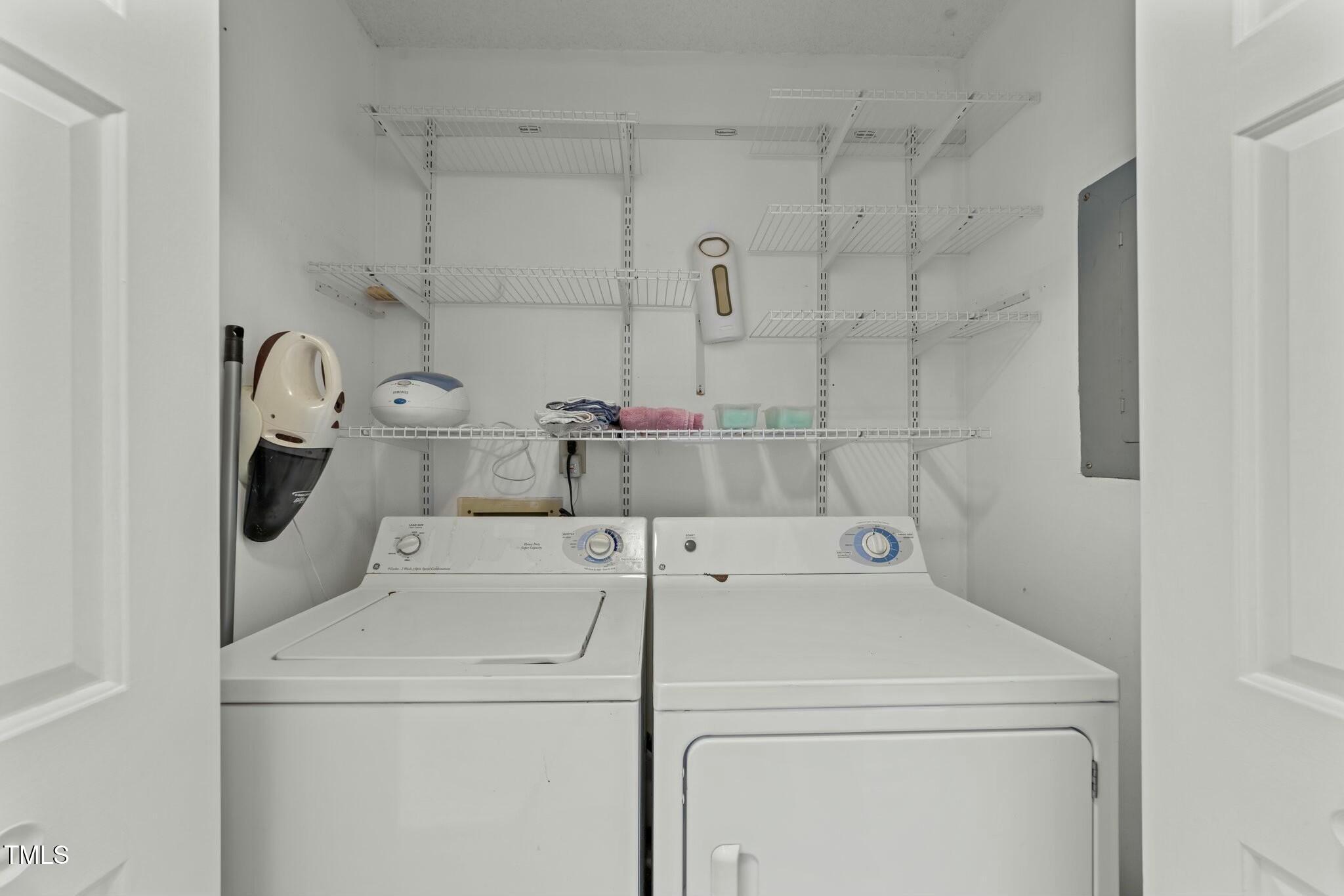 5809 Heatherbrook Circle Raleigh, NC 27612 - Photo 29 of 42 Hallway laundry closet with shelving.