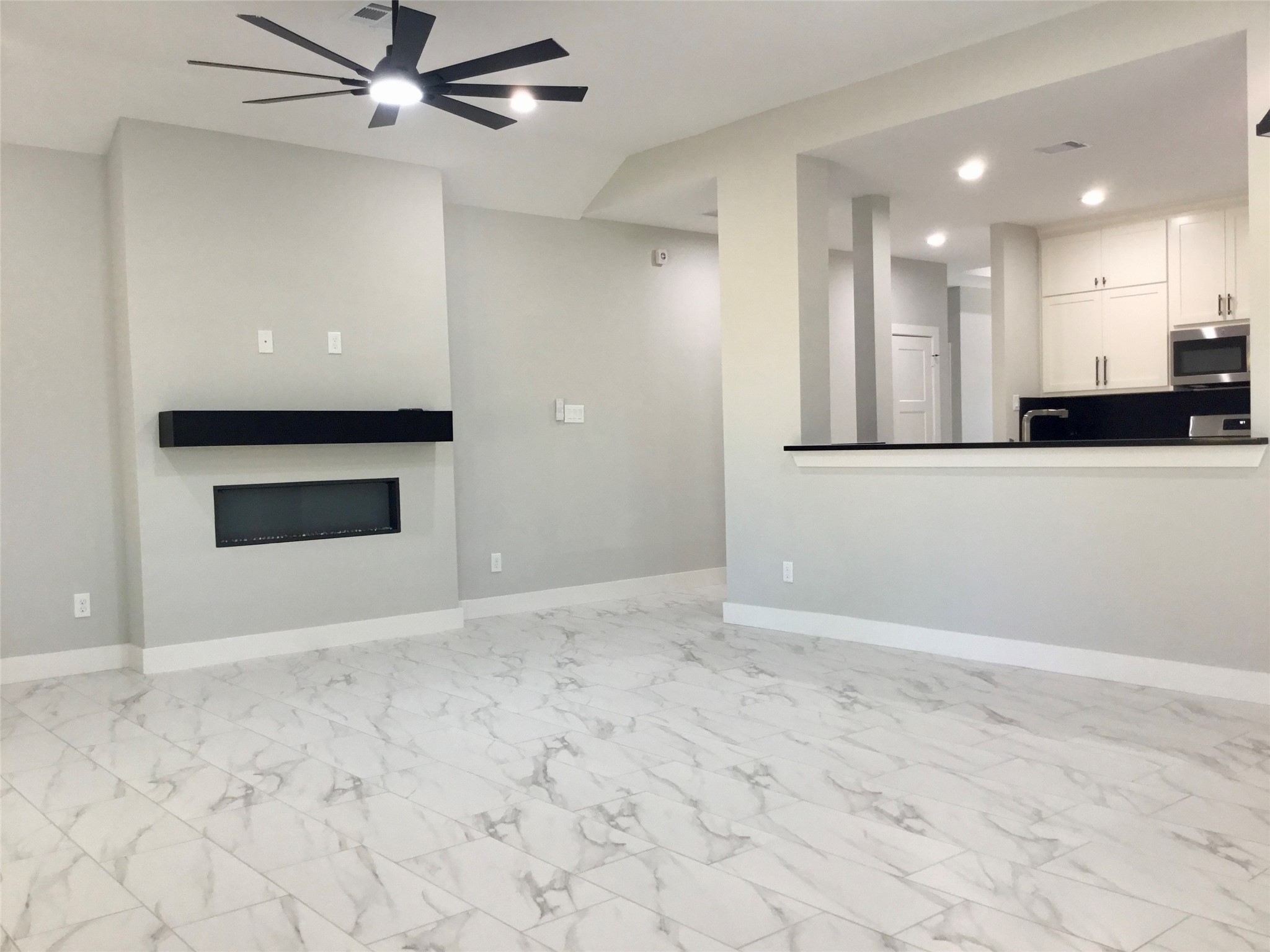 924 East 2nd Street Bellville, TX 77418 - Photo 17 of 38 a view of an empty room with kitchen stove and refrigerator