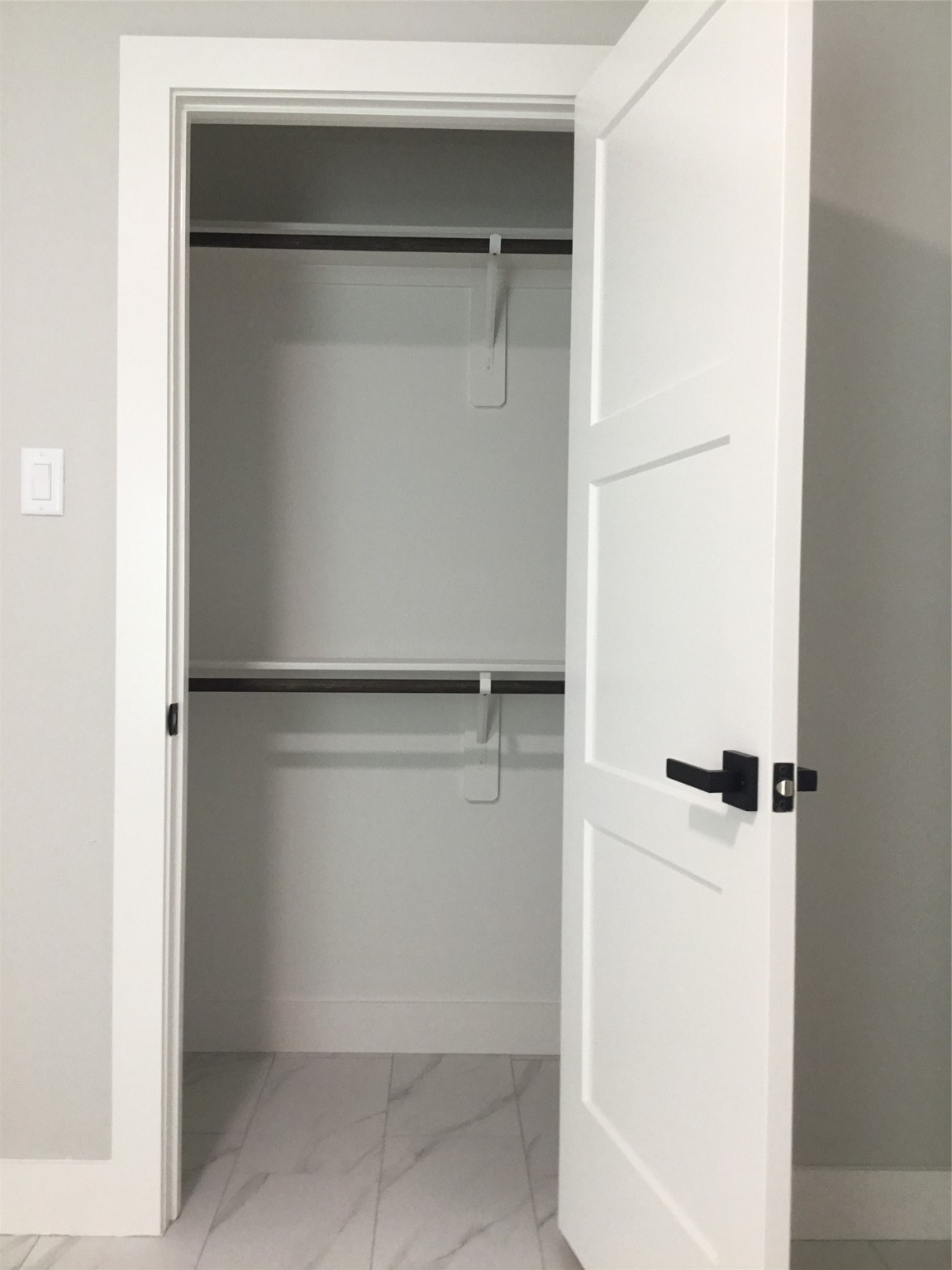 924 East 2nd Street Bellville, TX 77418 - Photo 25 of 38 a bathroom with a glass shower door