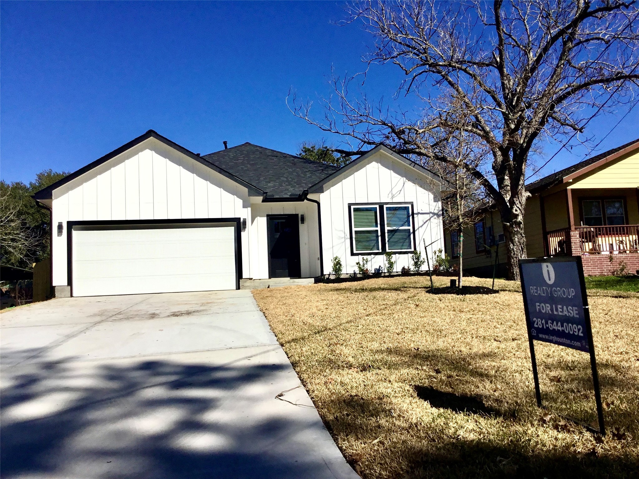 924 East 2nd Street Bellville, TX 77418 - Photo 3 of 38 a front view of a house with a yard