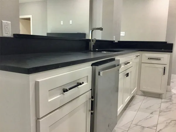 a kitchen with stainless steel appliances a stove and a refrigerator