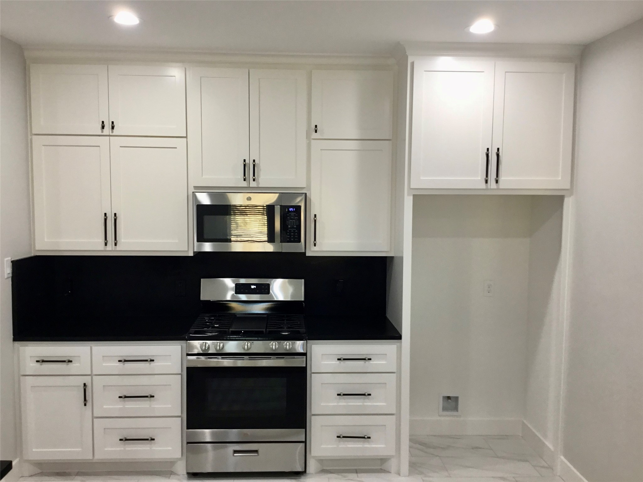 924 East 2nd Street Bellville, TX 77418 - Photo 8 of 38 a kitchen with stainless steel appliances a stove and a refrigerator