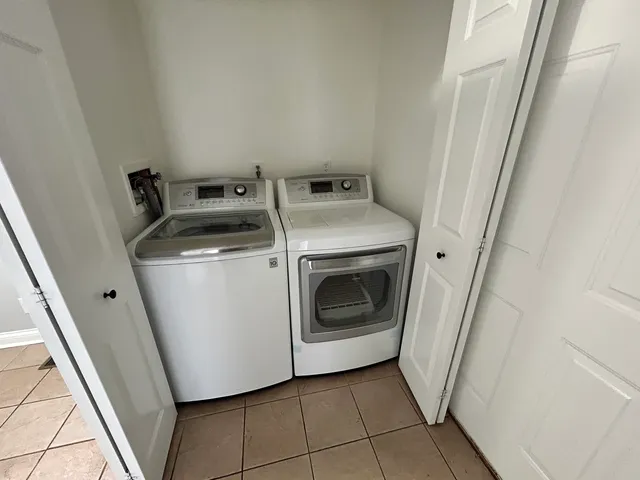 a utility room with dryer and washer