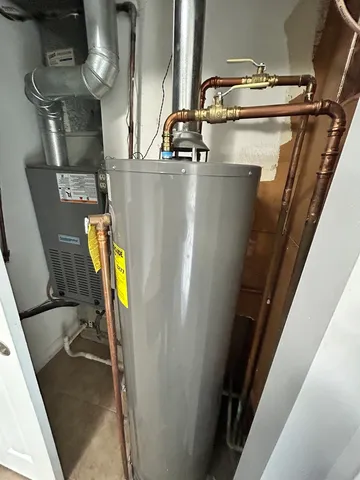 a view of a storage and utility room with washer and dryer