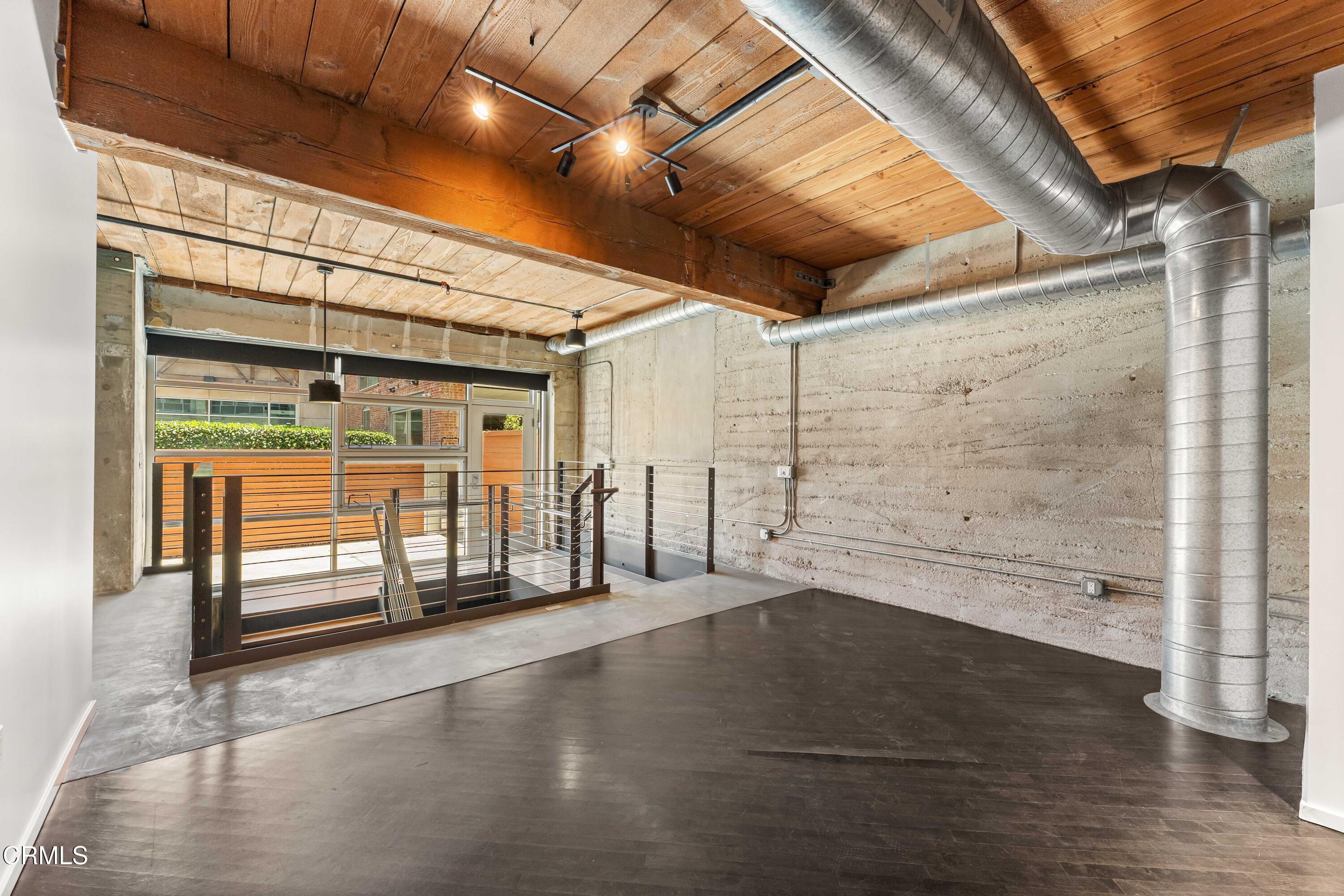 530 South Hewitt Street, Unit 130 Los Angeles, CA 90013 - Photo 14 of 53 a view of empty room with wooden floor