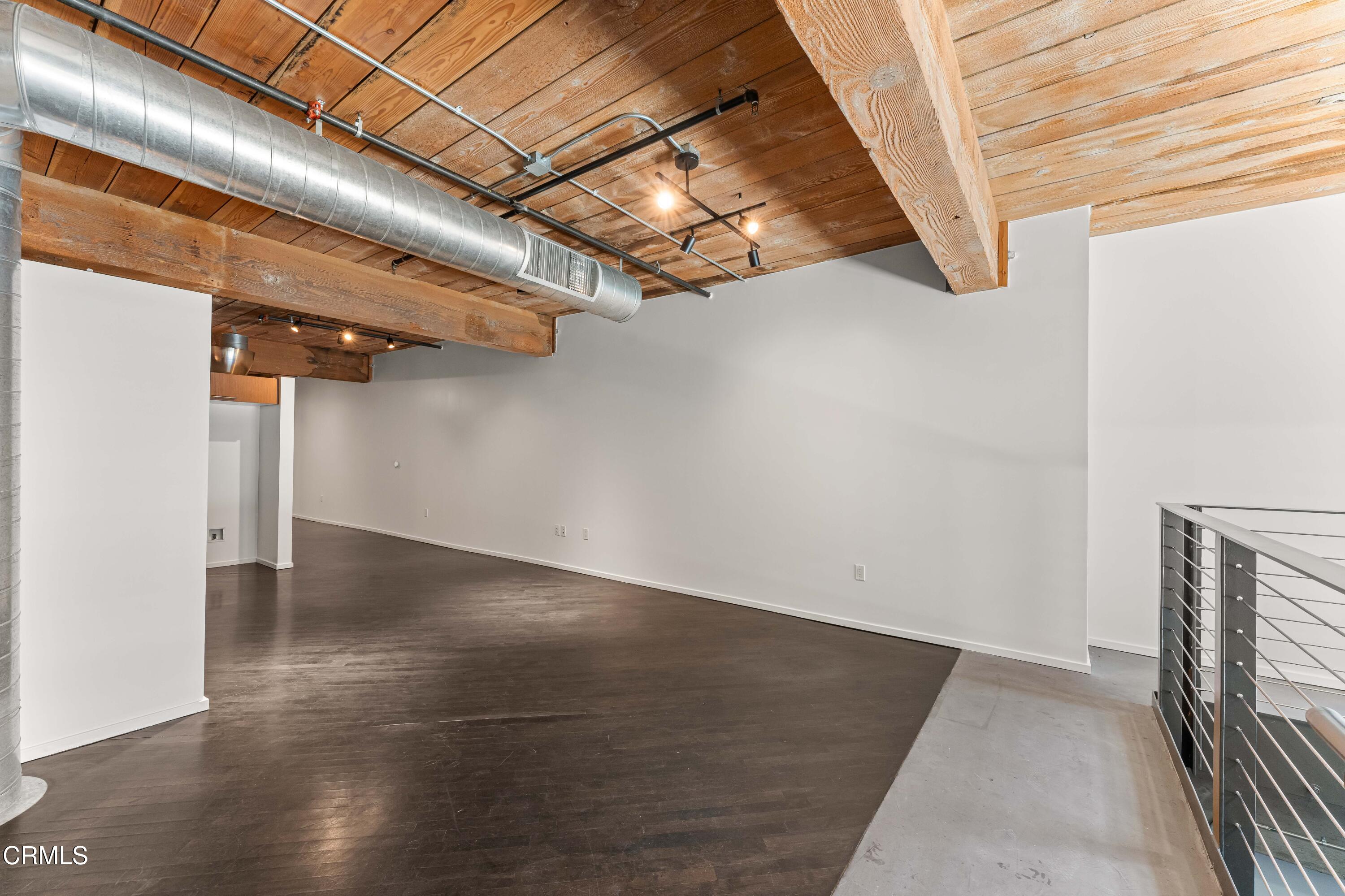 530 South Hewitt Street, Unit 130 Los Angeles, CA 90013 - Photo 17 of 53 a view of a room with wooden floor