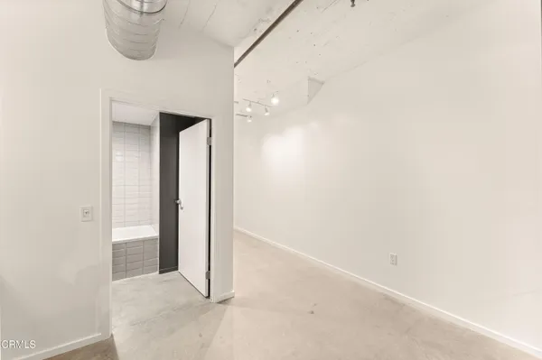 an empty room with a hallway