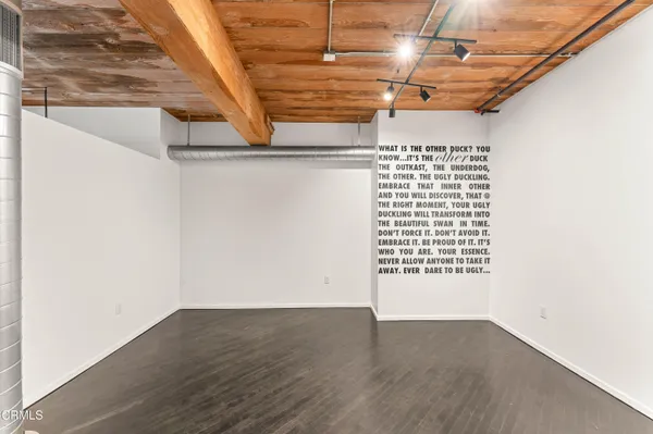 a view of a garage with wooden floor