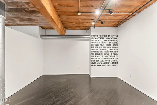 a view of a garage with wooden floor