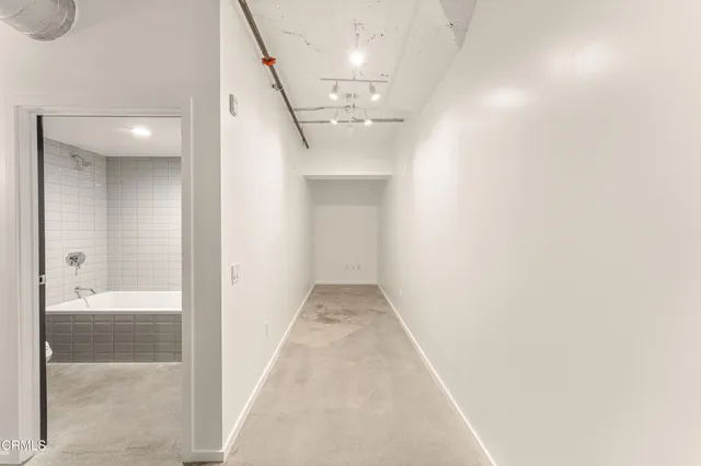 a bathroom with a bathtub and a toilet