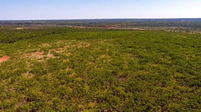 a view of an ocean and a mountain