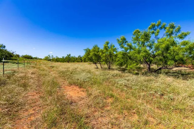 a view of a lake with a house in the background
