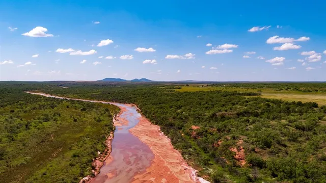 a view of a lake and a yard