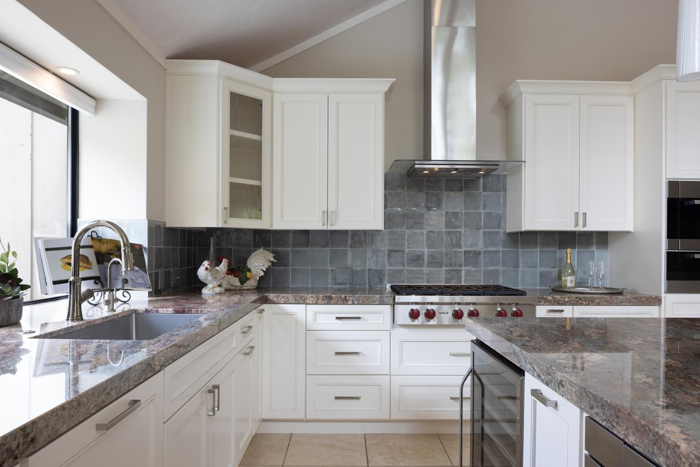 9621 Homestead Road Carmel, CA 93923 - Photo 13 of 30 a kitchen with cabinets appliances a sink and a counter top