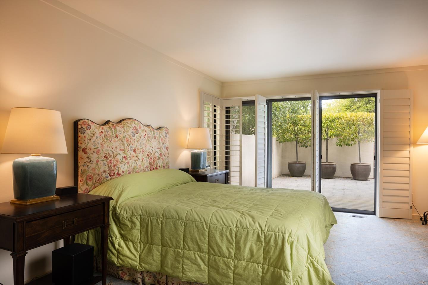 9621 Homestead Road Carmel, CA 93923 - Photo 16 of 30 a bedroom with a bed and a desk