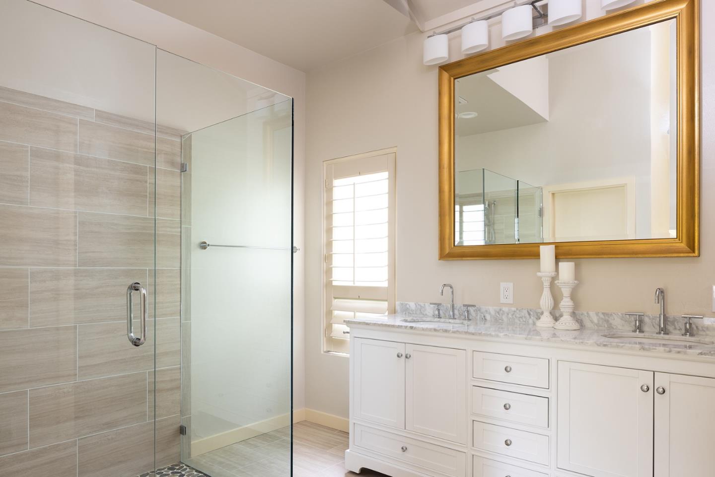 9621 Homestead Road Carmel, CA 93923 - Photo 17 of 30 a bathroom with a granite countertop sink mirror and