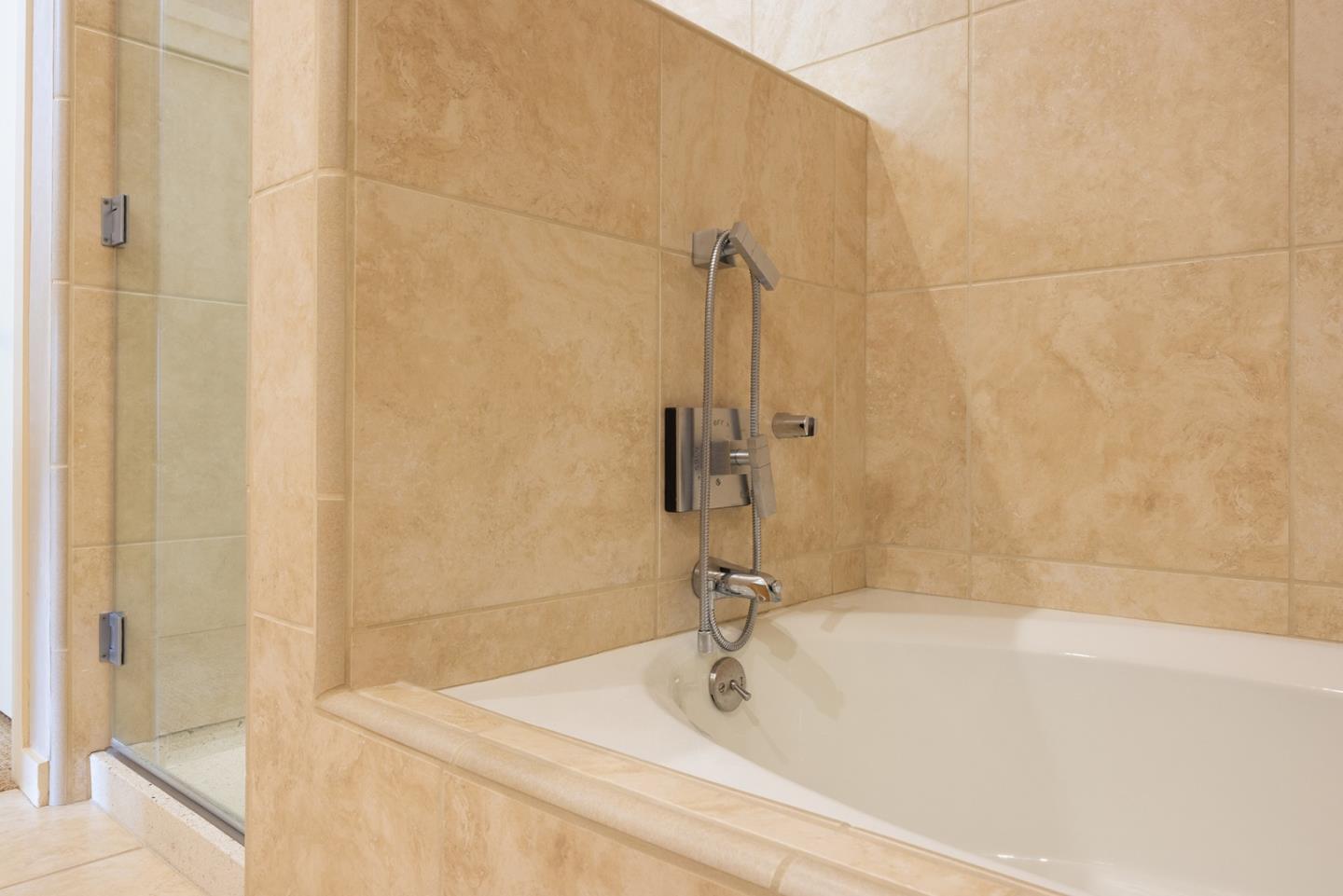 9621 Homestead Road Carmel, CA 93923 - Photo 22 of 30 a bathroom with a tub and a shower