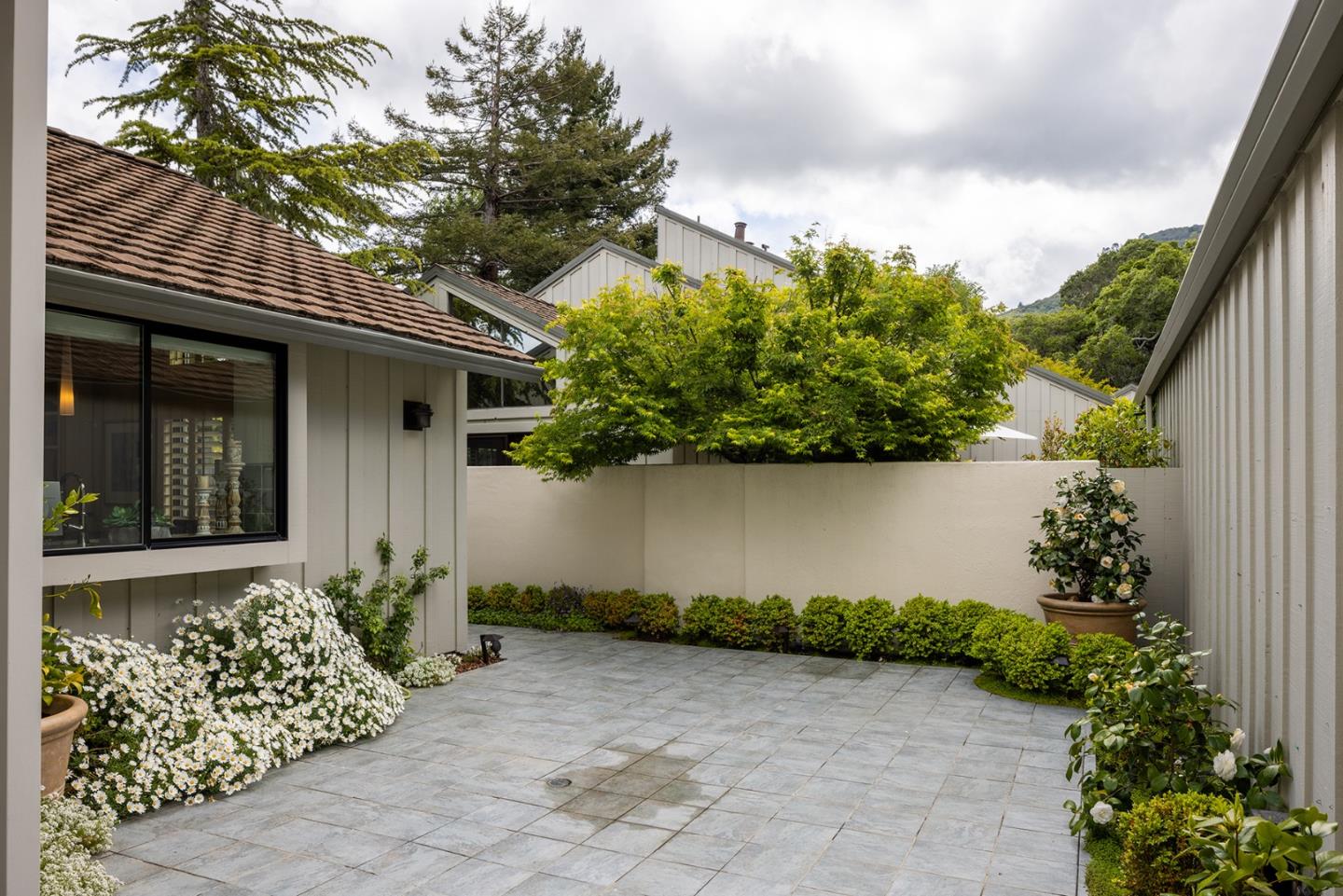 9621 Homestead Road Carmel, CA 93923 - Photo 23 of 30 a front view of a house with garden