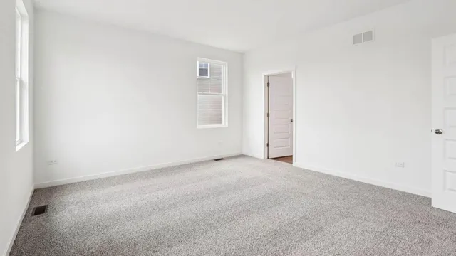 a bathroom with a double vanity sink mirror and shower