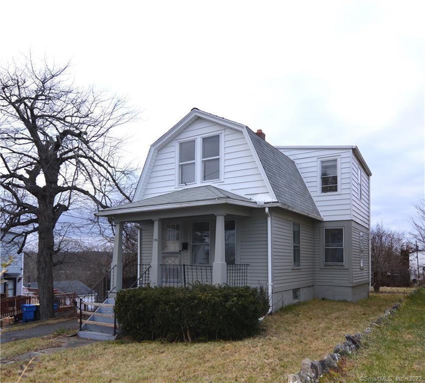 176 Chipman Street Waterbury, CT 06708 - Photo 1 of 1 a front view of a house with a garden