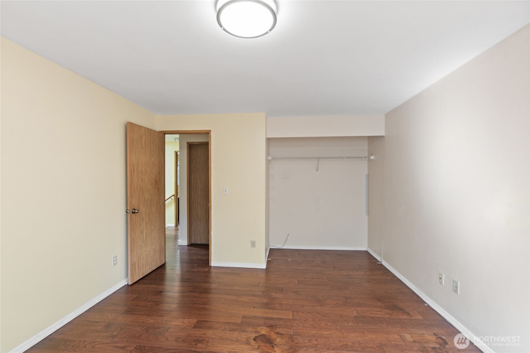 10606 68th Place South Seattle, WA 98178 - Photo 15 of 31 a view of an empty room with wooden floor and closet