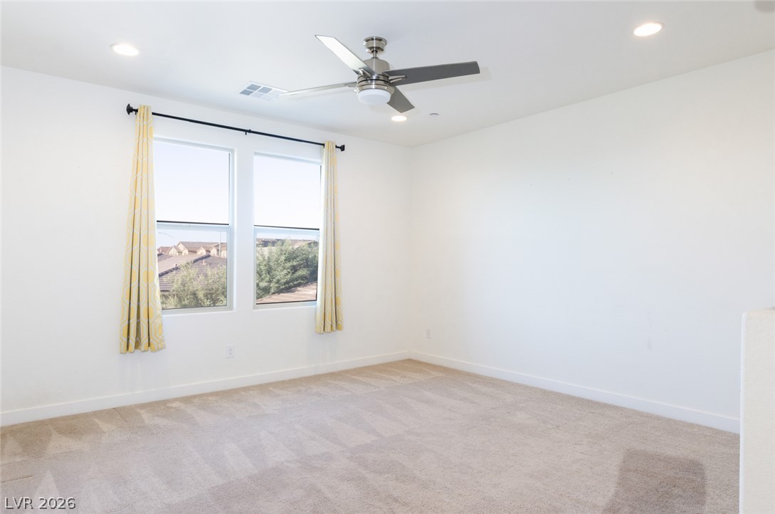 920 East Sunset Road Henderson, NV 89011 - Photo 11 of 33 An airy loft area features neutral carpet and recessed lighting.