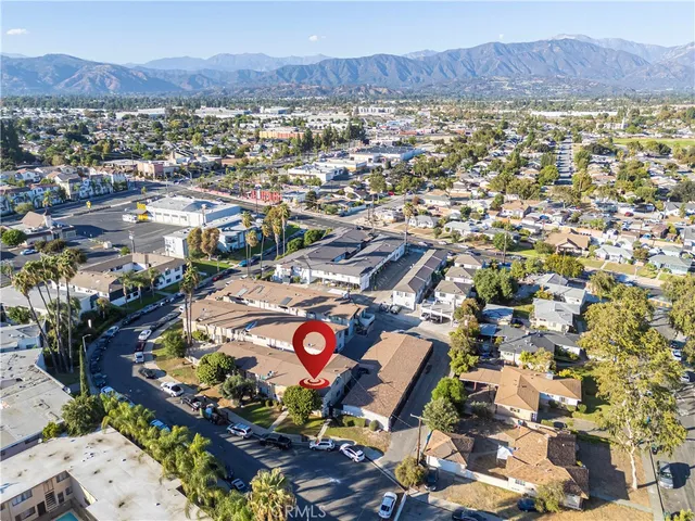 an aerial view of residential houses and outdoor space