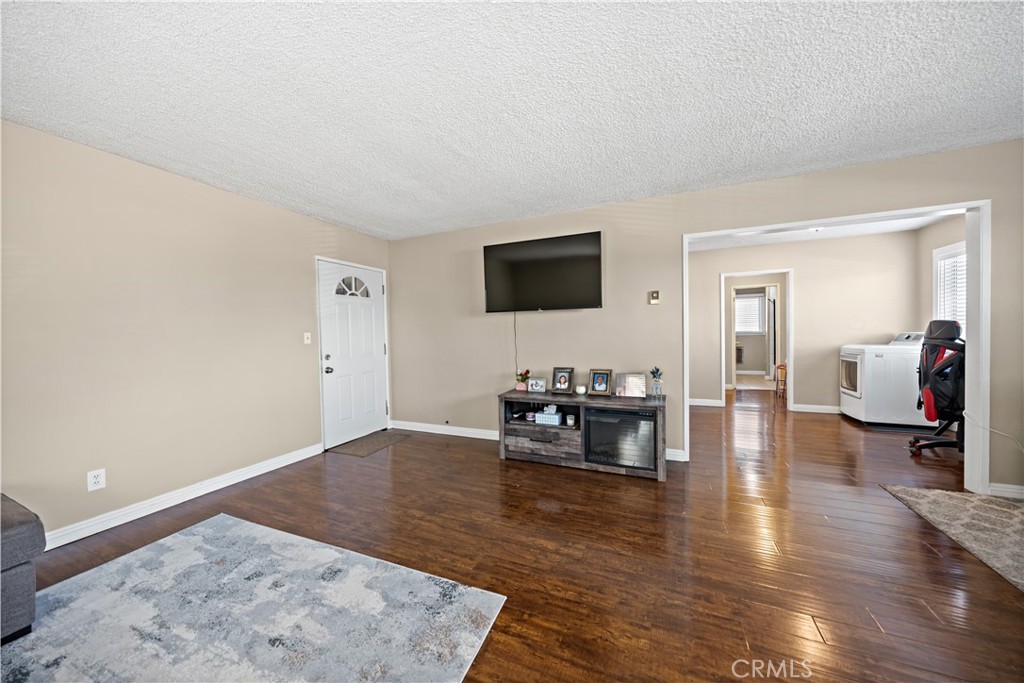 2018 Las Vegas Avenue, Unit 18 Pomona, CA 91767 - Photo 3 of 23 a living room with furniture and a flat screen tv