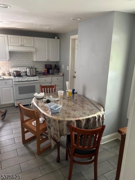 21 2nd Street Somerville, NJ 08876 - Photo 6 of 15 a kitchen with a dining table and chairs