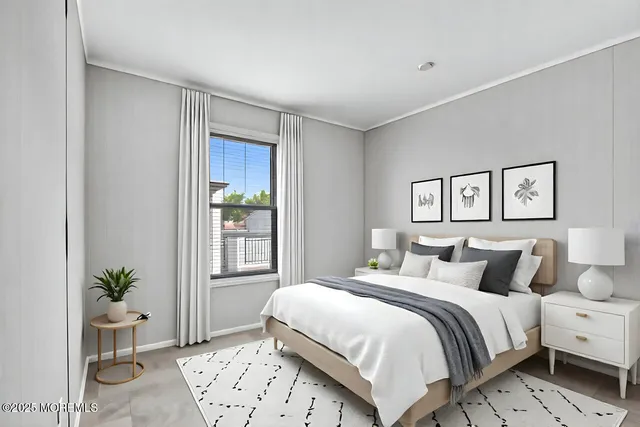 a bedroom with a large bed and a potted plant