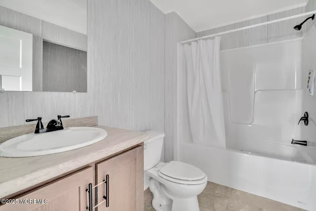 a bathroom with a sink a toilet and a bathtub