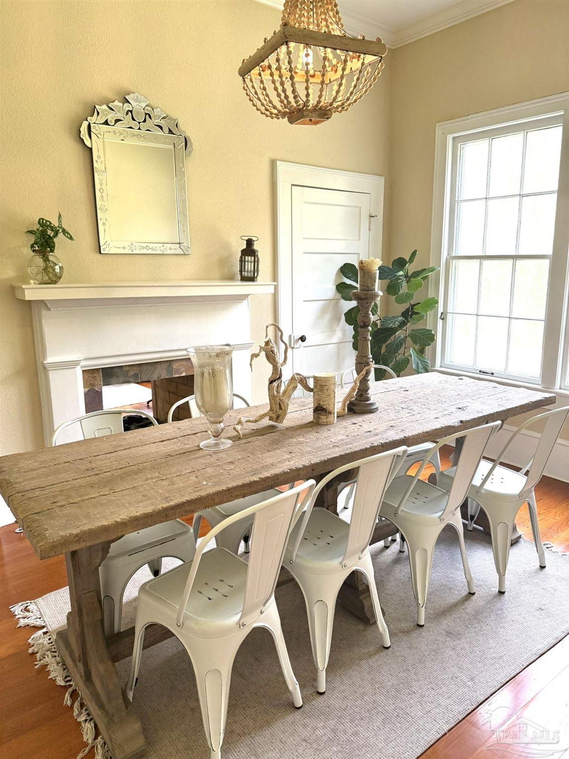 6855 Pine Street Milton, FL 32570 - Photo 11 of 31 a dining room with furniture and window
