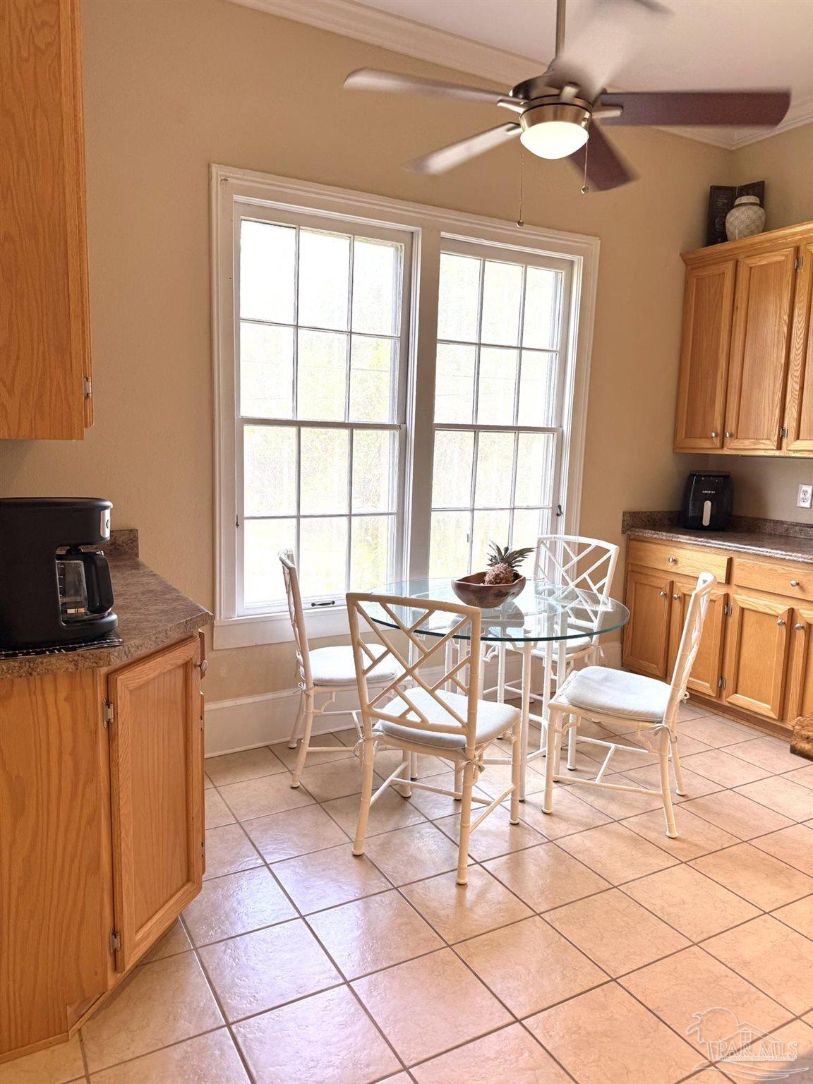 6855 Pine Street Milton, FL 32570 - Photo 12 of 31 a view of a dining room with furniture window and outside view