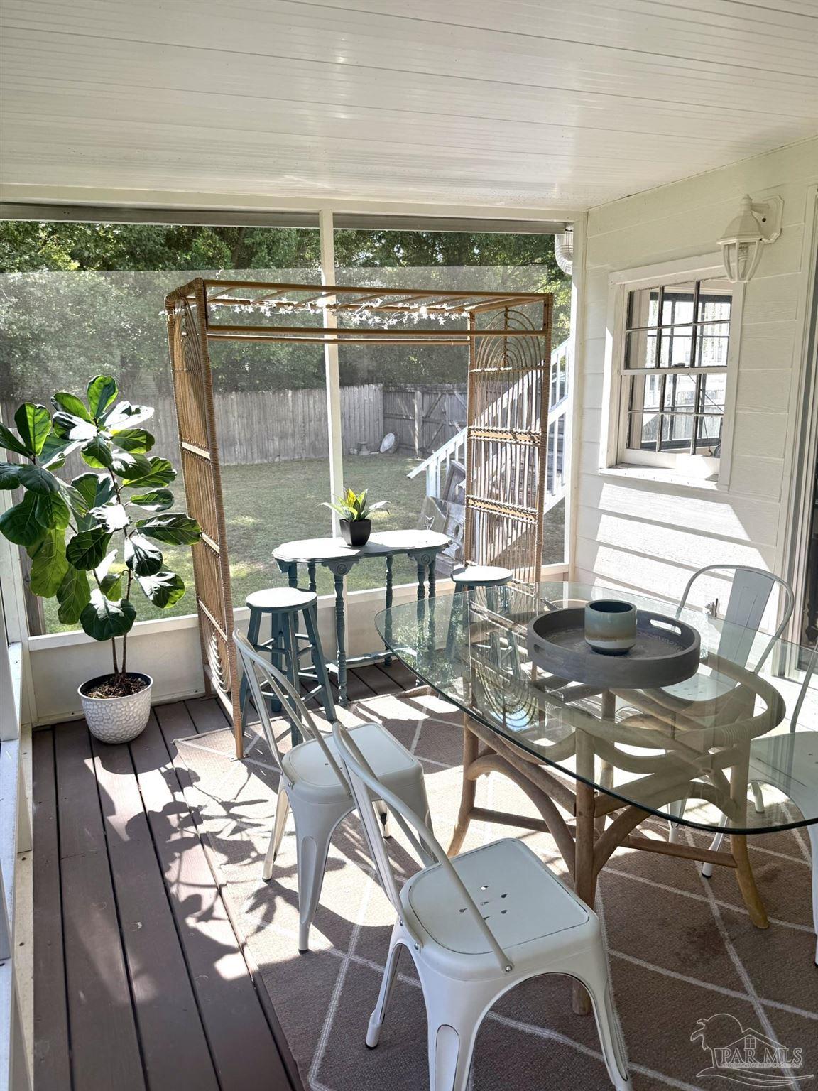 6855 Pine Street Milton, FL 32570 - Photo 17 of 31 a dining room with furniture