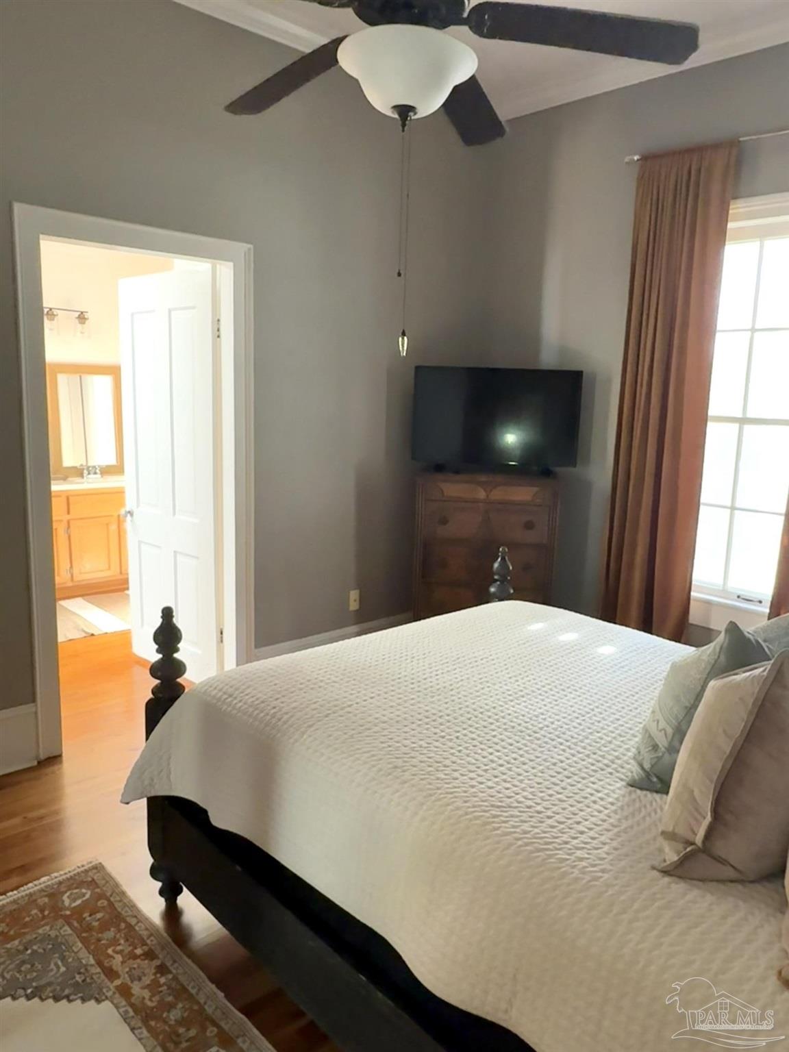 6855 Pine Street Milton, FL 32570 - Photo 20 of 31 a bedroom with a bed and window