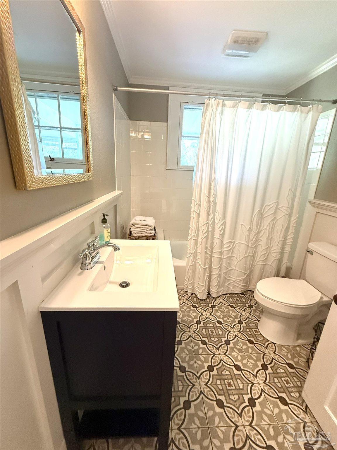6855 Pine Street Milton, FL 32570 - Photo 23 of 31 a bathroom with a sink toilet and shower